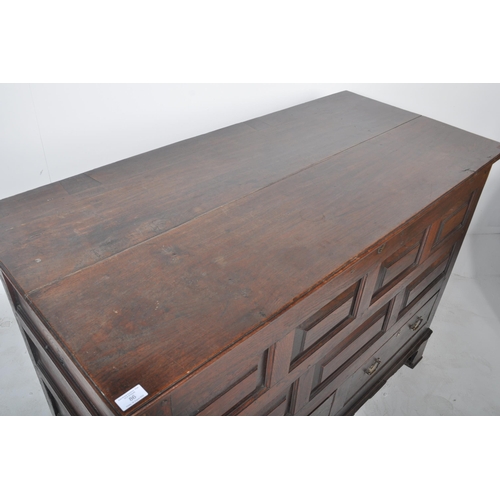 113 - An 18th Century George III oak mule chest coffer blanket box. Geometric block panelled front with tw... 