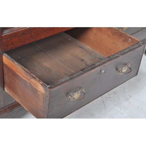 113 - An 18th Century George III oak mule chest coffer blanket box. Geometric block panelled front with tw... 