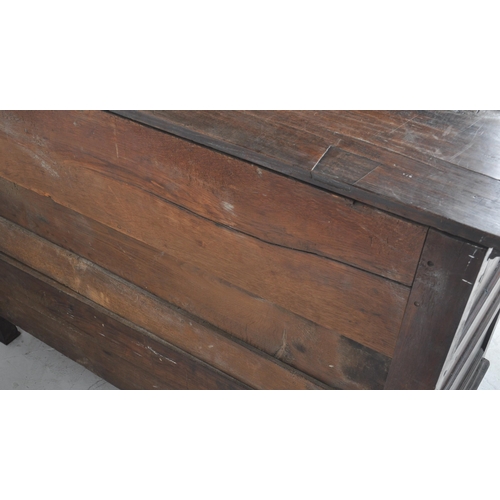 113 - An 18th Century George III oak mule chest coffer blanket box. Geometric block panelled front with tw... 