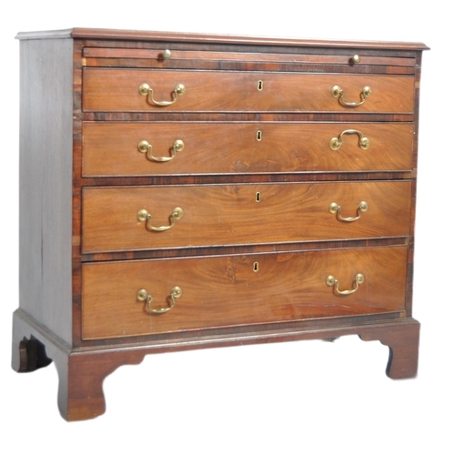 115 - An 18th Century George III mahogany bachelors chest of drawers. Walnut crossbanded top with a gradua... 