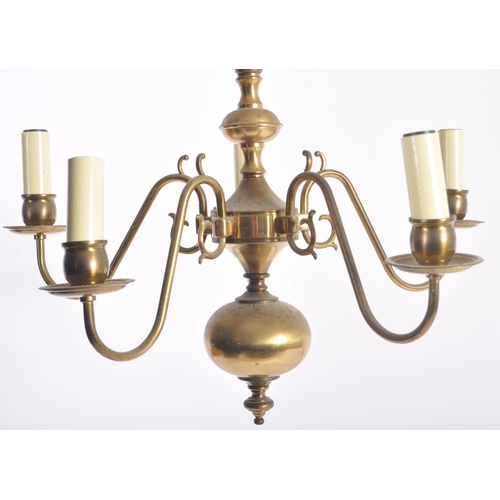 116 - A 20th Century Dutch manner brass ceiling light chandelier. Typical form with globular centre with f... 