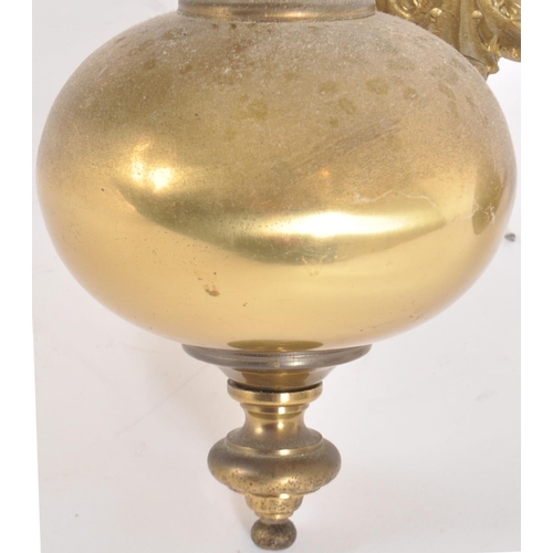 116 - A 20th Century Dutch manner brass ceiling light chandelier. Typical form with globular centre with f... 