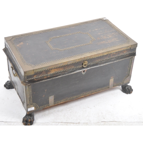 117 - An early 19th Century George III Regency period leather and brass bound campaign travel trunk having... 