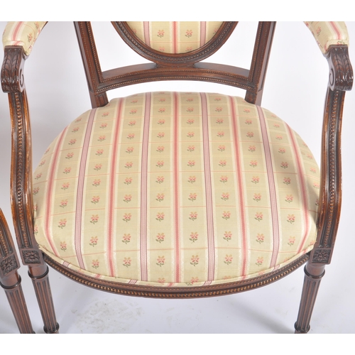 118 - A pair of 20th Century Edwardian mahogany armchairs / armchairs having carved show wood frames with ... 