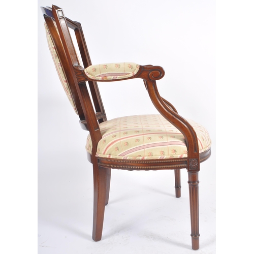 118 - A pair of 20th Century Edwardian mahogany armchairs / armchairs having carved show wood frames with ... 