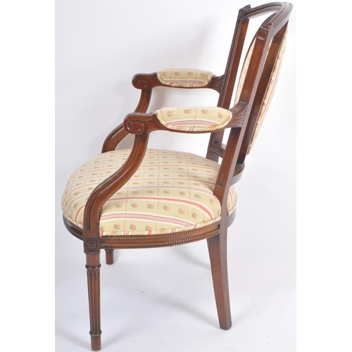 118 - A pair of 20th Century Edwardian mahogany armchairs / armchairs having carved show wood frames with ... 