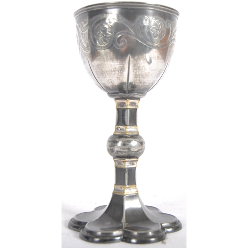 119 - A 19th Century silver plated goblet having engraved decoration to the bowl having a fluted stem with... 