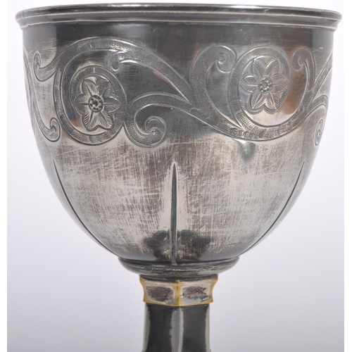 119 - A 19th Century silver plated goblet having engraved decoration to the bowl having a fluted stem with... 