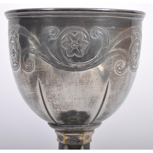 119 - A 19th Century silver plated goblet having engraved decoration to the bowl having a fluted stem with... 