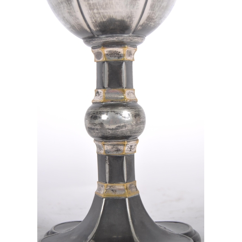 119 - A 19th Century silver plated goblet having engraved decoration to the bowl having a fluted stem with... 