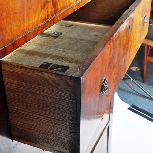 121 - A large 19th Century French Empire Revival mahogany chest of drawers having a flared top with curved... 