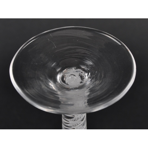 122 - A double series wine drinking glass having a trumpet shaped bowl with white opaque double series air... 