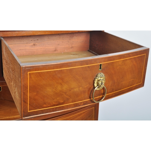 124 - An early 19th Century George III mahogany inlaid bow fronted chest of drawers. The bank of two over ... 