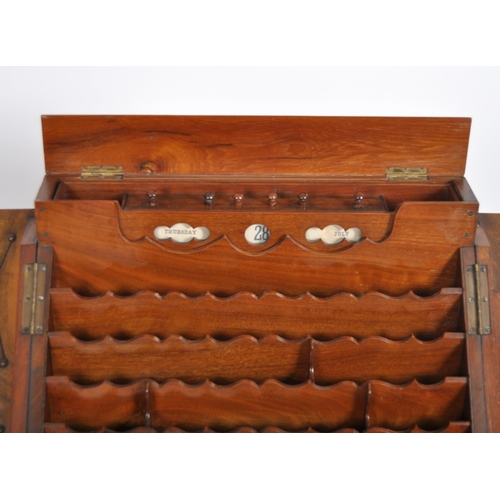 126 - A 19th Century figured walnut desk tidy stationery box compendium. Twin doors opening to reveal a fu... 