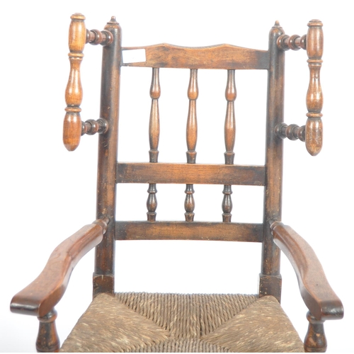 127 - A 19th Century Lancashire / North Country oak childs rocking chair with spindle back and wings havin... 