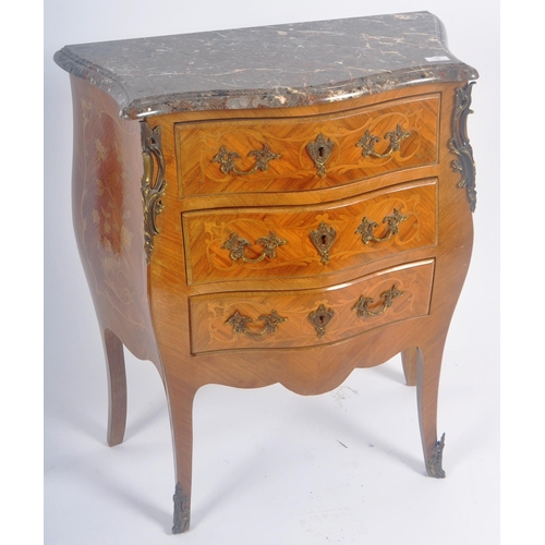 128 - A 20th Century French style walnut & marble commode chest of drawers. The bank of drawers being serp... 