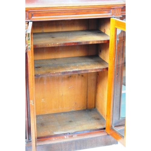 129 - An large 19th Century Victorian mahogany breakfront library bookcase cabinet having and arched back ... 