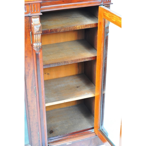 129 - An large 19th Century Victorian mahogany breakfront library bookcase cabinet having and arched back ... 