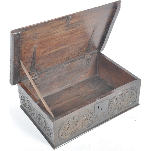 13 - A 17th Century carved oak bible box. Rectangular form with carved rose to lid. The sides and top car... 