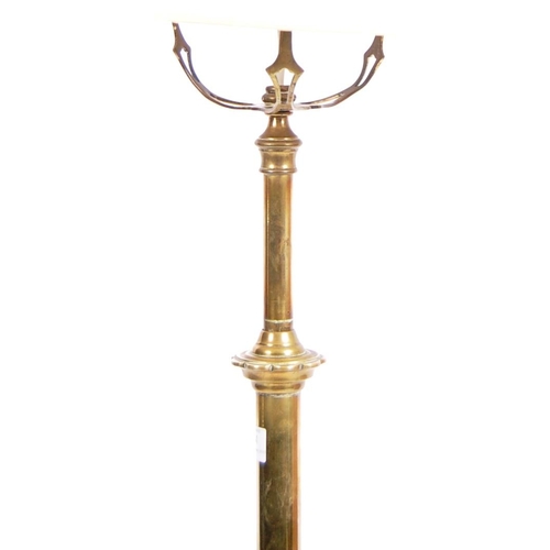 134 - An early 20th Century Art Nouveau brass telescopic standard lamp light. Cylindrical form with adjust... 