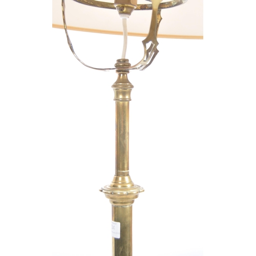 134 - An early 20th Century Art Nouveau brass telescopic standard lamp light. Cylindrical form with adjust... 