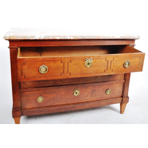 135 - A 19th Century French mahogany commode chest of drawers having a chamfered edge marble top over thre... 