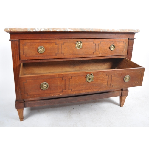 135 - A 19th Century French mahogany commode chest of drawers having a chamfered edge marble top over thre... 