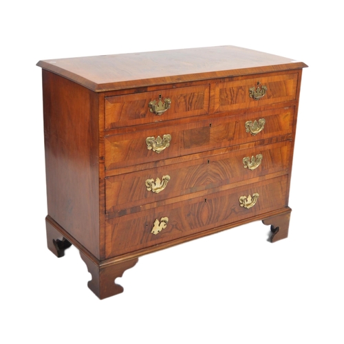 140 - A 19th Century Queen Anne revival walnut two over three chest of drawers. The bank of drawers having... 