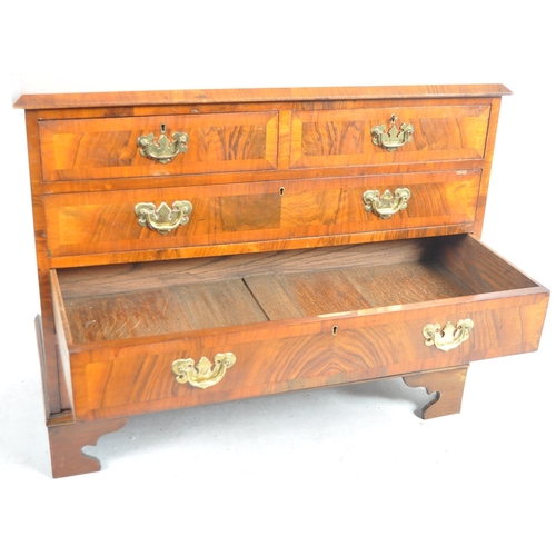 140 - A 19th Century Queen Anne revival walnut two over three chest of drawers. The bank of drawers having... 