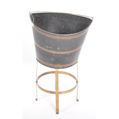 146 - A 19th Century tin and brass peat bucket of navette form having a brass carrying handle atop with pa... 