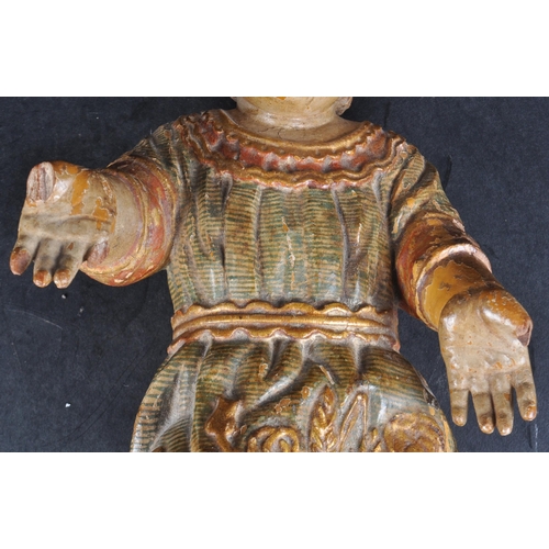 147 - An 18th century Italian wood carved child Christ.  Polychrome painted, finely carved detailing of fl... 