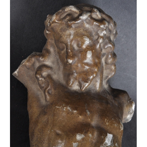 148 - A 19th century terracotta sculpture of Christ on the cross. Terracotta base, gesso applied and grey ... 