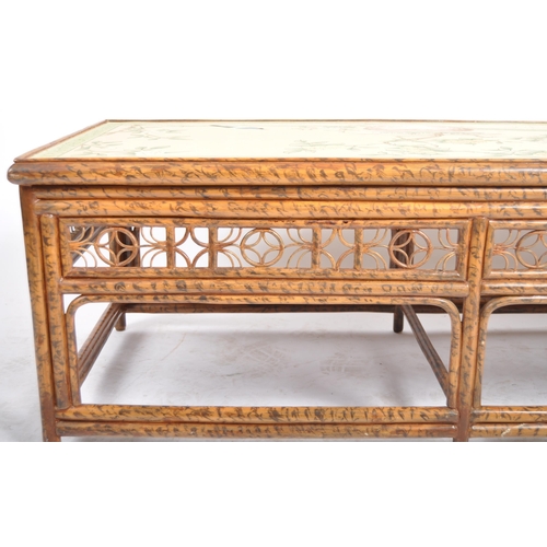 151 - An early 20th Century Chinoiserie bamboo low coffee table of rectangular form having a painted flora... 