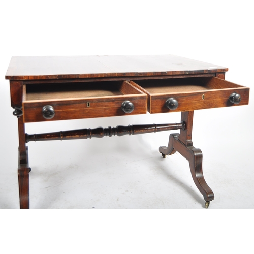 153 - An early 19th Century Regency rosewood library table / writing table desk having a line inlaid top w... 