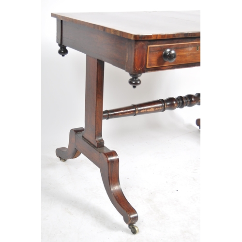 153 - An early 19th Century Regency rosewood library table / writing table desk having a line inlaid top w... 