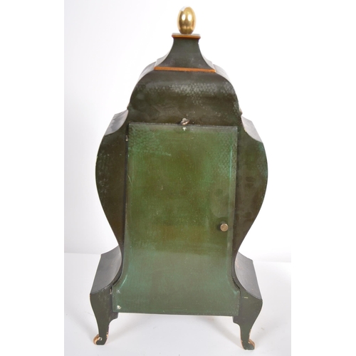 156 - A 20th Century painted bracket clock on matching wall bracket shelf. Large glazed door with gilt det... 