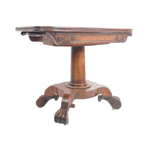 157 - A 19th Century William IV mahogany tea table. Metamorphic folding swivel action to with carved friez... 