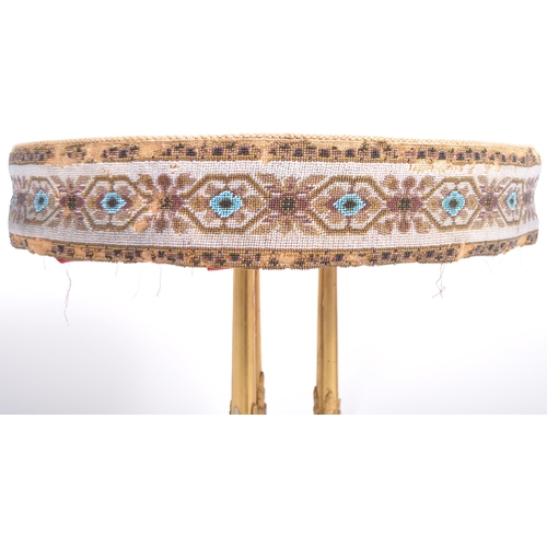 159 - A 19th Century carved giltwood gypsy table. Embroidered and berlin bead work circular top raised on ... 