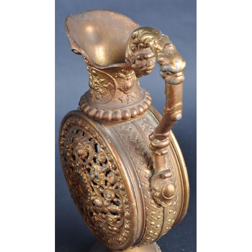 161 - A pair of early 20th Century gilt metal pilgrim flasks / ewer jugs. Lead interiors with pierced clas... 