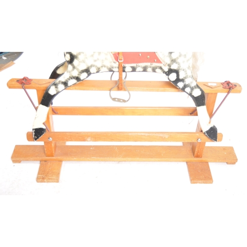 163 - A 19th Century Victorian rocking horse by Collinson. Painted black and white decoration with hair ma... 