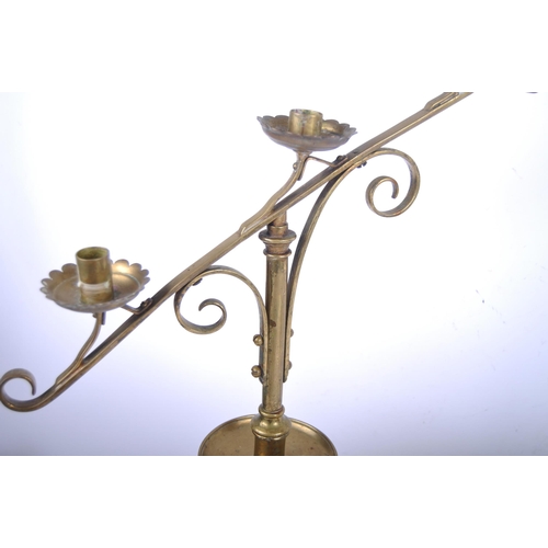 164 - A pair of 19th Century brass ecclesiastical Gothic triple sconce candlesticks / candelabra in the ma... 