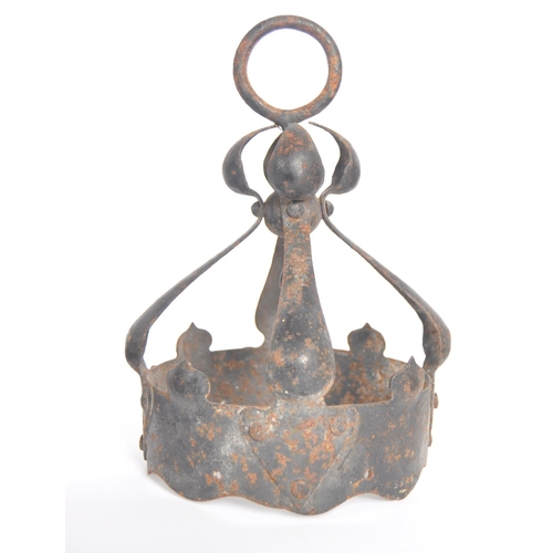 166 - A 19th Century wrought metal Arts & Crafts wrought metal wall light comprising a shaped metal wall a... 