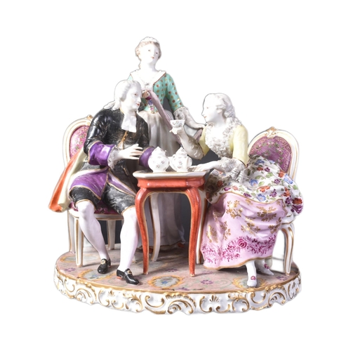 167 - A 19th Century porcelain Meissen figurine group. Depicts a group drinking tea with lady seated holdi... 