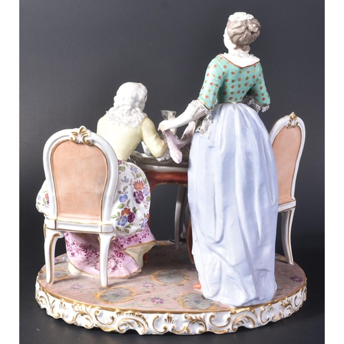 167 - A 19th Century porcelain Meissen figurine group. Depicts a group drinking tea with lady seated holdi... 