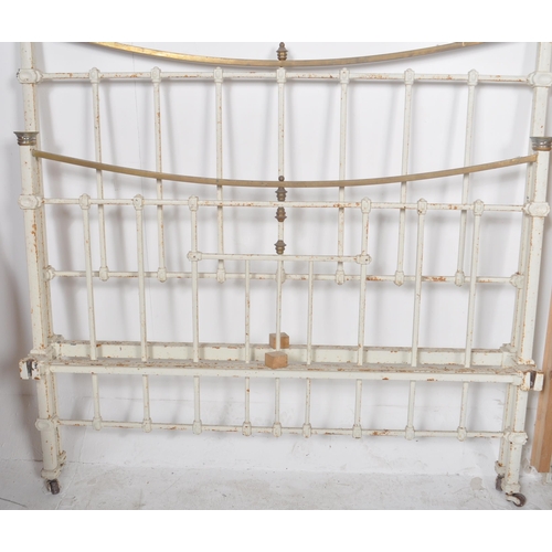 168 - A 19th Century Victorian brass and iron double sized bed finished in white with straight and curved ... 