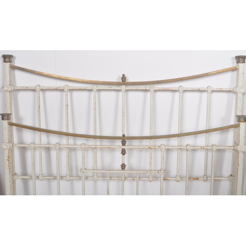 168 - A 19th Century Victorian brass and iron double sized bed finished in white with straight and curved ... 