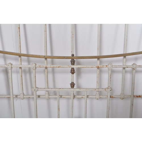 168 - A 19th Century Victorian brass and iron double sized bed finished in white with straight and curved ... 