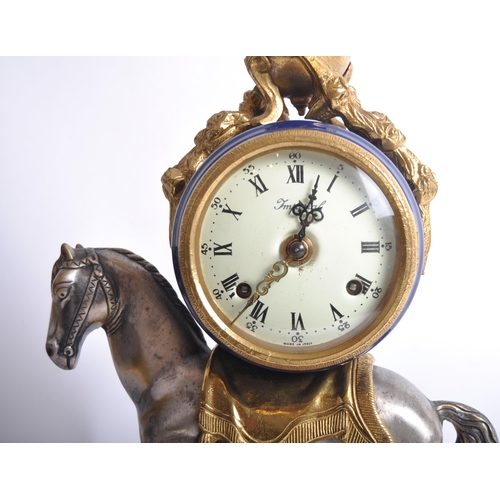 175 - A 20th century Italian gilt-metal ormolu mounted equestrian Imperial mantel clock. The cobalt blue g... 