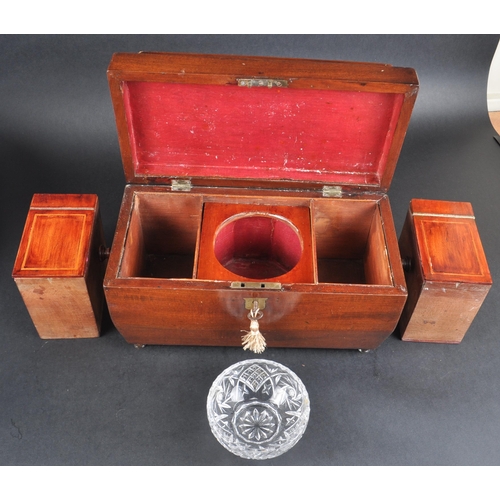 177 - A 19th Century mahogany Regency tea caddy having a sarcophagus form lid with bombe sides and twin ha... 