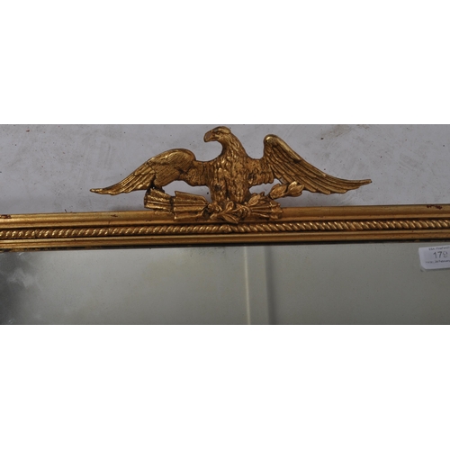 179 - An early 20tth Century gilt wall mirror of rectangular form having a rope moulded frame with inset m... 